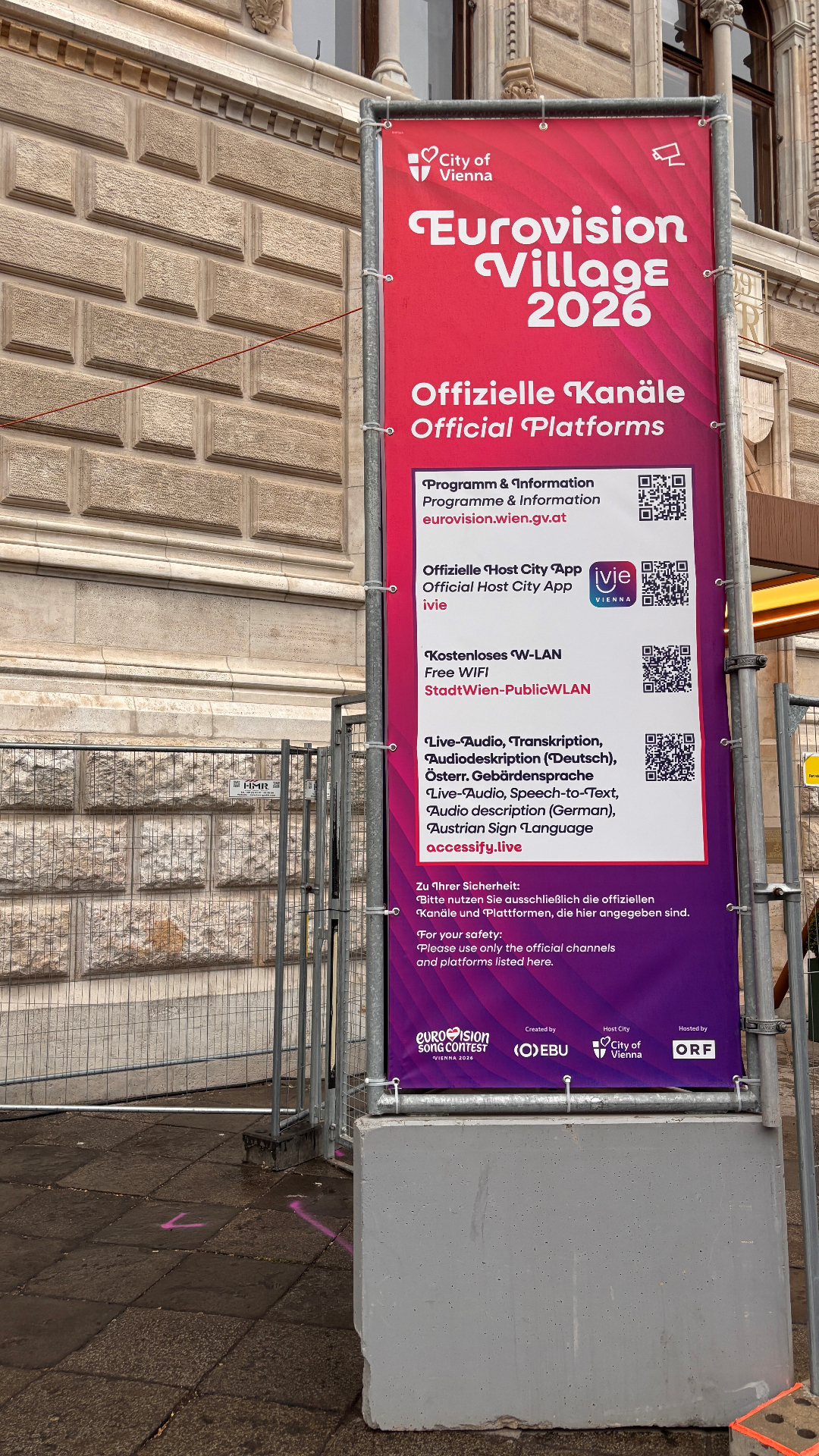 Accessify signage with QR code on the official Eurovision Village 2026 platforms banner at Rathausplatz, Vienna